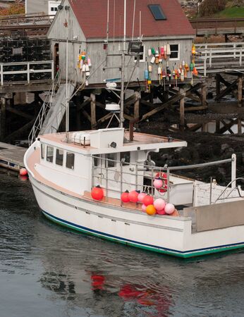 Lobster boat docked in Maineの写真素材