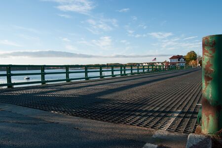Old steel bridge crossing a harbor in New Hampshireの写真素材