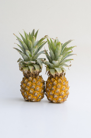 Yellow fresh pineapple on white backgroundの写真素材