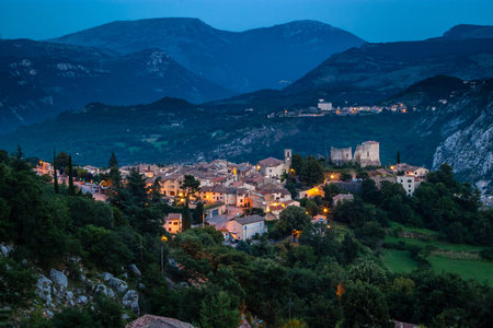 It is a narrow street lined with streets and mountains.