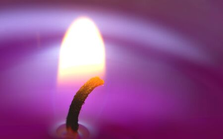 Macro shot of the glowing wick of a scented candleの写真素材