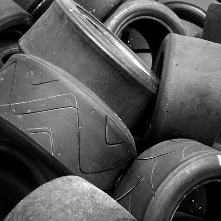 Pile of used racing car tyresの写真素材