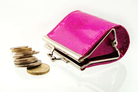 Shiny pink purse with the contents tipped outの写真素材