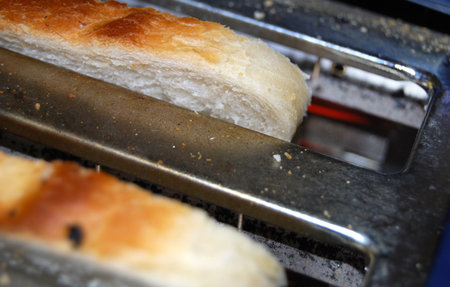 Two slices of bread in an old toaster