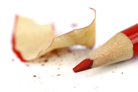 Macro shot of a red crayon and sharpeningsの写真素材