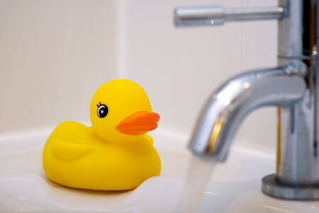 Rubber duck waiting to be played with at bath time.の写真素材