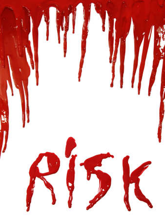 The word RISK in dripping red paint (as blooding) isolated on whiteの写真素材
