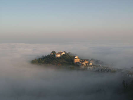 Landscape submerged by fog.の写真素材