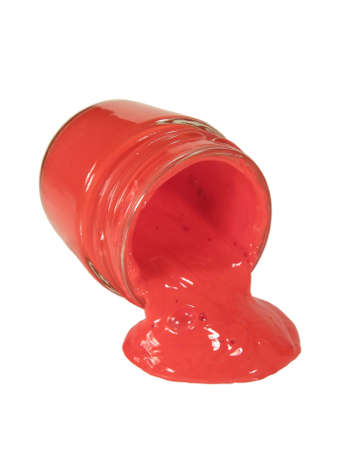 Orange paint from a glass can, isolated on white.の写真素材