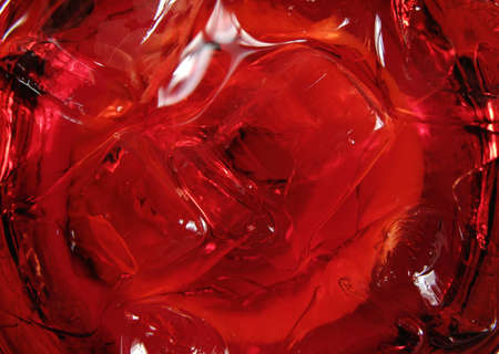Ice in a red cocktail. Macro.の写真素材