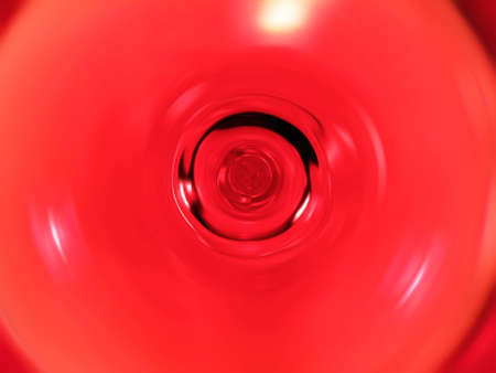 Abstract red circle blurred from liquid.の写真素材