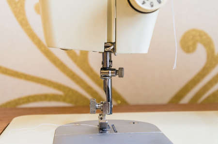 A closeup of a sewing machine, an old sewing machine.の写真素材