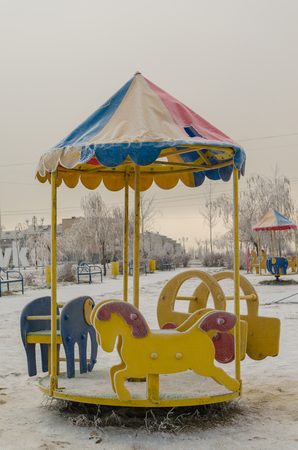 Lonely playground on a cold winter day.の写真素材