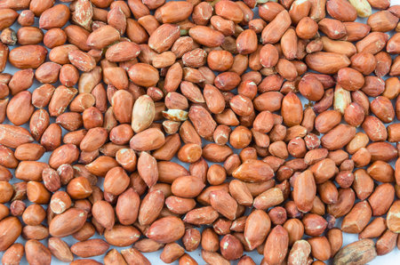 A variety of lying peanuts on a white background.