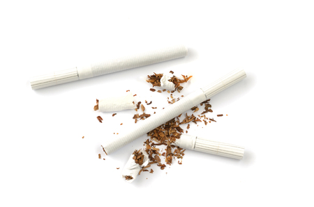 Differently lying cigarettes on a white background.の写真素材