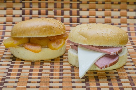 Hamburger bun with different fillings, assorted on a beautiful background.の写真素材