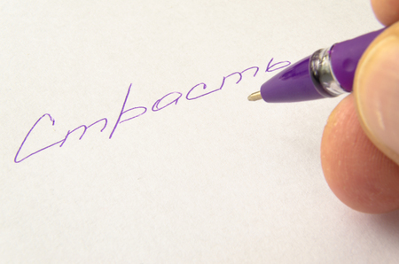 Valentine's day love words written in pen on white paper.の写真素材