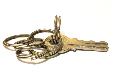 Shiny Chinese keys closeup isolated on white background.の写真素材