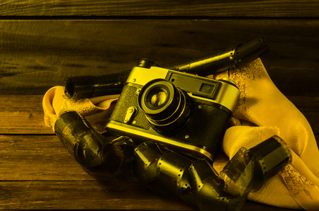 Still life photographic film and film camera on different backgrounds.の写真素材