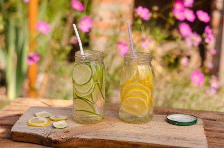 A diverse view of fresh fruit juices on a wooden table and beautiful backgrounds.