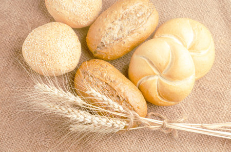 An assortment of lush pastries and spikelets on burlap.