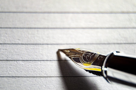 Macro photo of a fountain pen on paper.