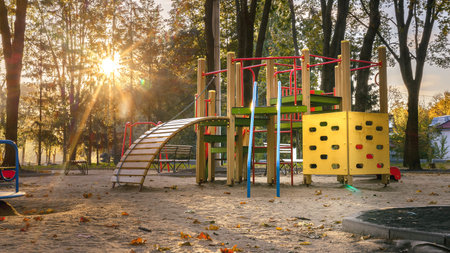 Empty playground at sunrise in autumn scenery