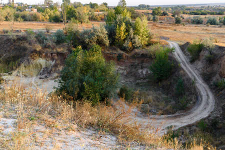 Sand pit in the autumn sunset.の写真素材