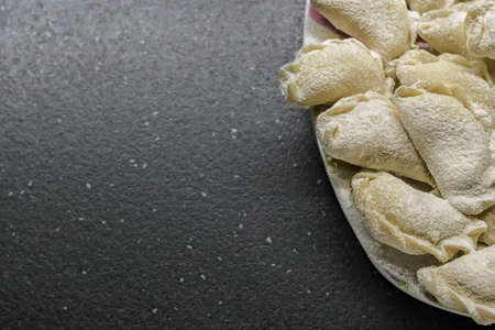 Flour dough top view a lot of homemade dumplings. free place.の写真素材