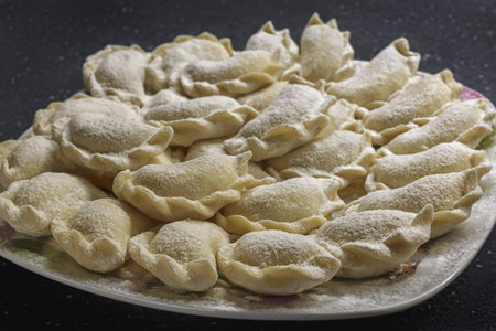 Flour dough top view a lot of homemade dumplings. free place.の写真素材