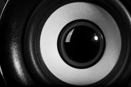 Artistic close-up shot of a hi-fi speaker in black and white, showing the intricate design of the speaker cone and texture.の写真素材