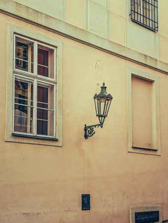 A scenic view of the historic architecture of Prague, showing a panorama of ancient buildings with characteristic red-tiled roofs. This image captures the unique charm and timeless beauty of the Czech capital, famous for its well-preserved medieval core. Ideal for representing European culture, travel, and heritage.の写真素材