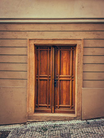 Old European wooden door with stone frame, showing classic architecture and cultural heritage.の写真素材