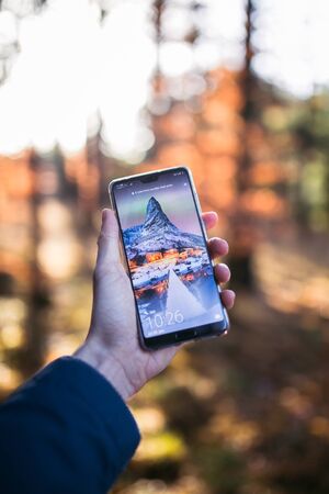 Colorful leaves and smart phone.の写真素材