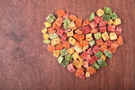 mix dried fruits heart shape collection on woodの写真素材