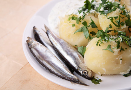 Boiled potatoes with salted fishの写真素材