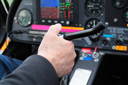 Pilot's hand at the helm of the airplane.の写真素材