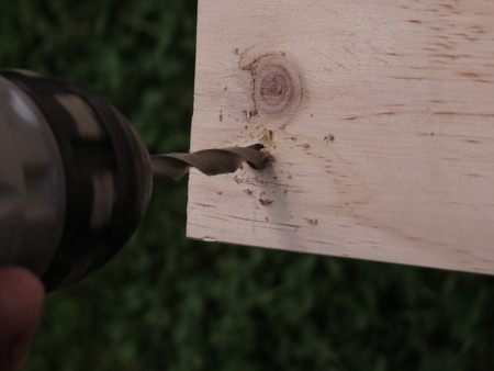 drilling a hole in a piece of woodの写真素材