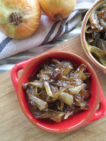 Home made caramelised onion in colourful bowlsの写真素材