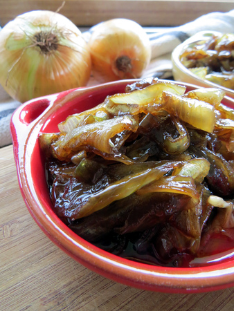 Home made caramelised onion in colourful bowlsの写真素材