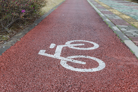 Bike lanes symbol on red brown road,Busan,South Koreaの写真素材