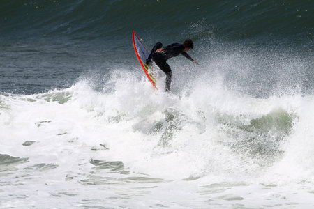 surfer riding ocean wave in Anglet ( france)