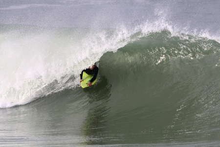 body boarder in action on a powerful wave in Anglet ( france )の写真素材