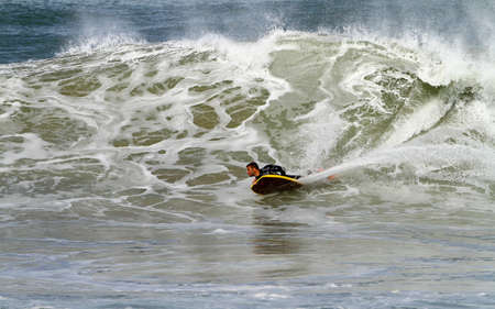 bodyboarder on a powerful waveの写真素材