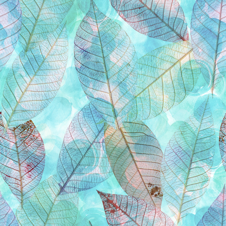 A seamless watercolor background pattern with teal blue skeleton leaves, faded and tonedの写真素材