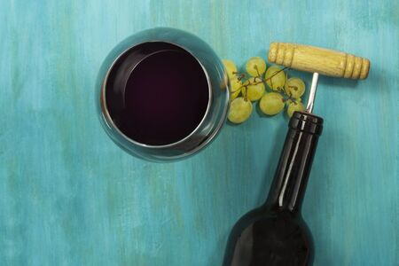 Wine background with glass, grapes, bottle, and copyspaceの写真素材