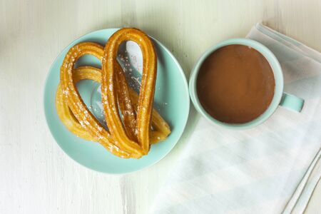 Churros with hot chocolate, traditional Spanish breakfastの写真素材