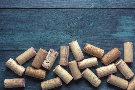 Wine corks on dark wooden texture with copyspaceの写真素材