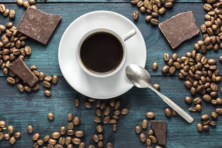 Coffee cup photo with grains and chocolateの写真素材