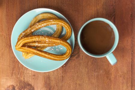 Churros with hot chocolate, traditional Spanish breakfastの写真素材